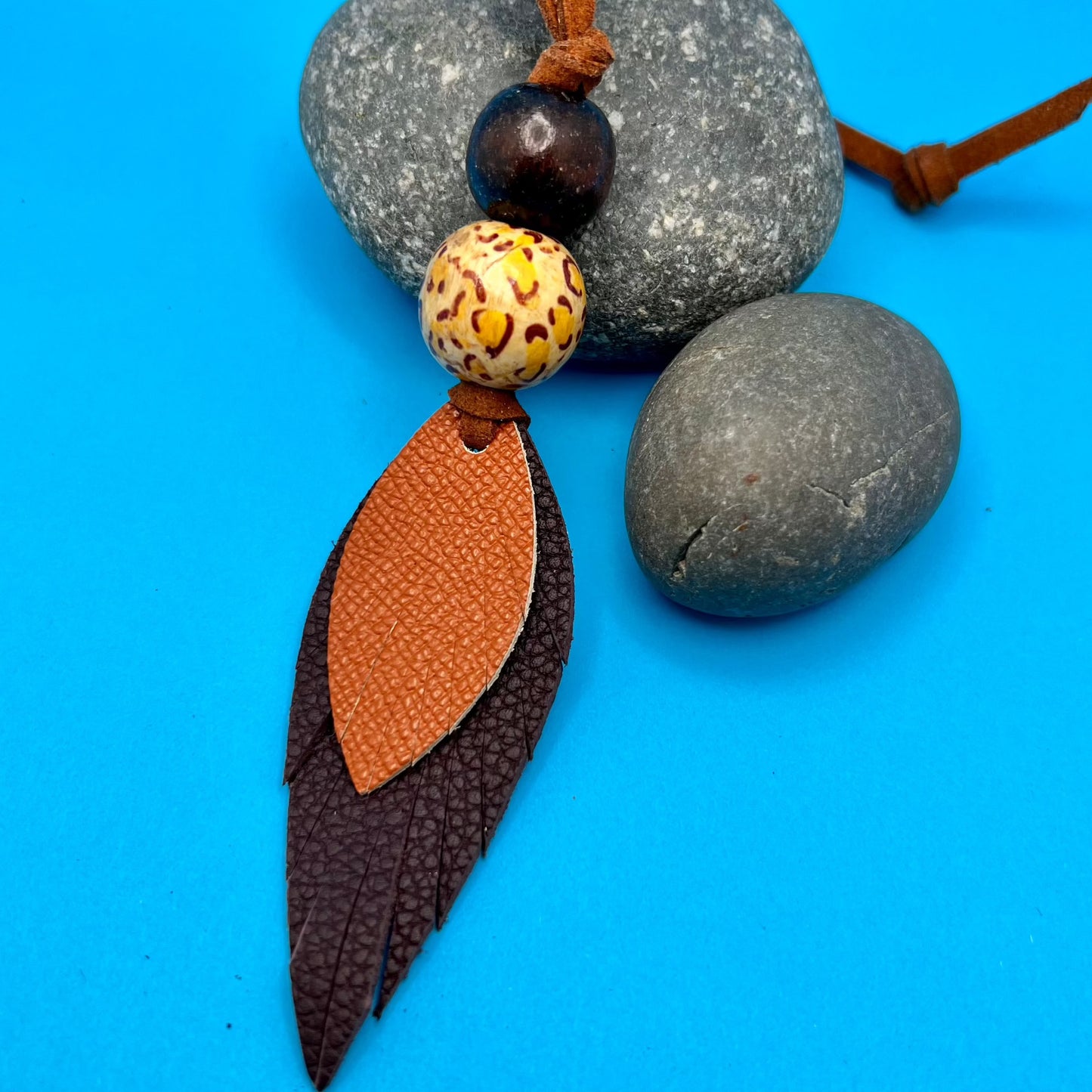 purple and orange leather feather purse charm