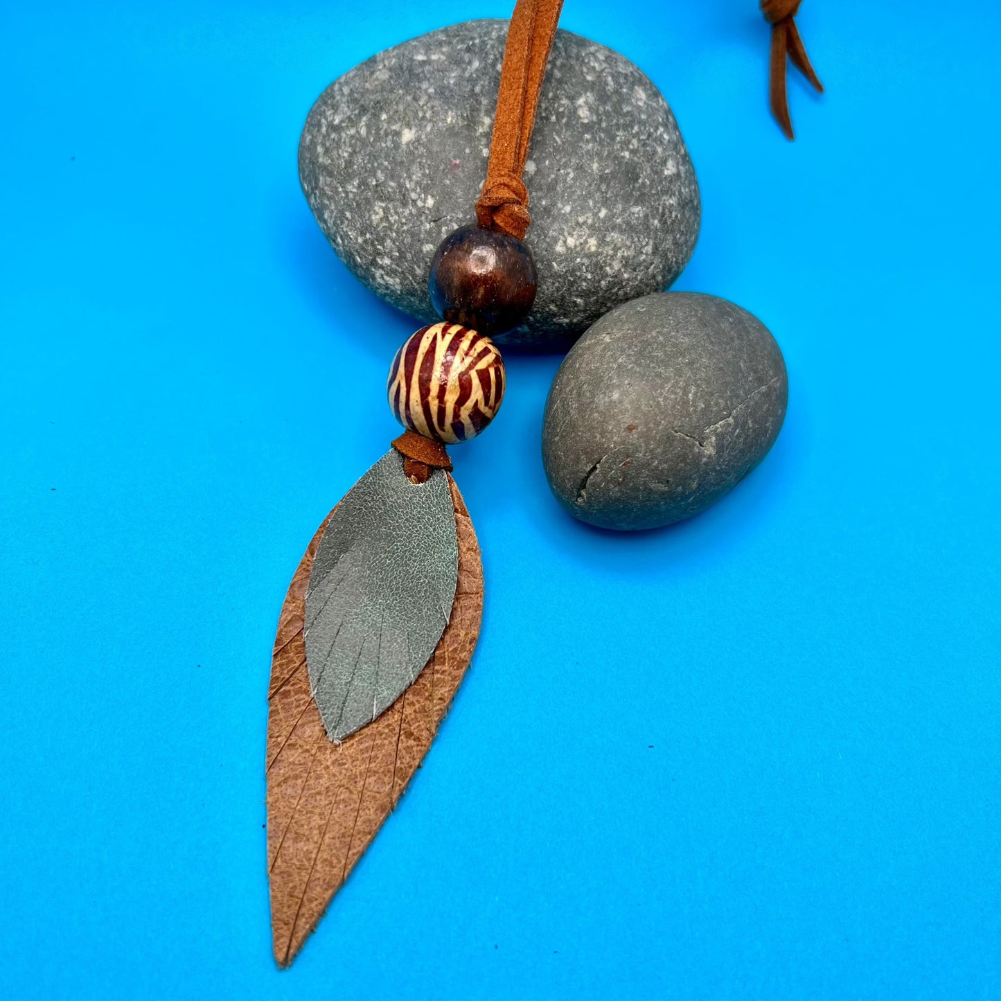 brown and green leather purse charm