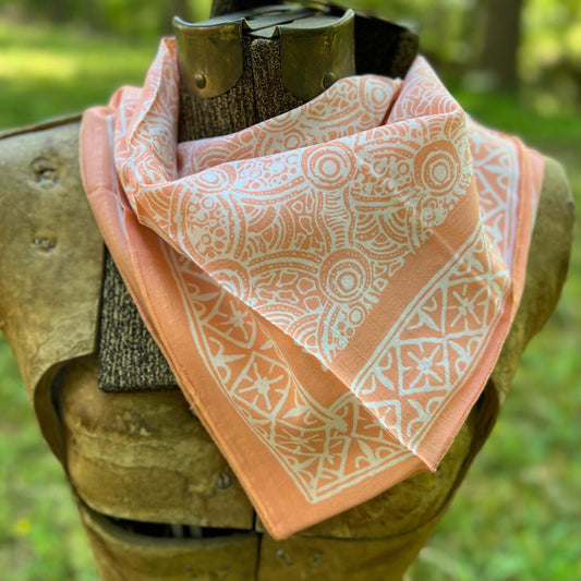 Patterned bandana with a blurred green background