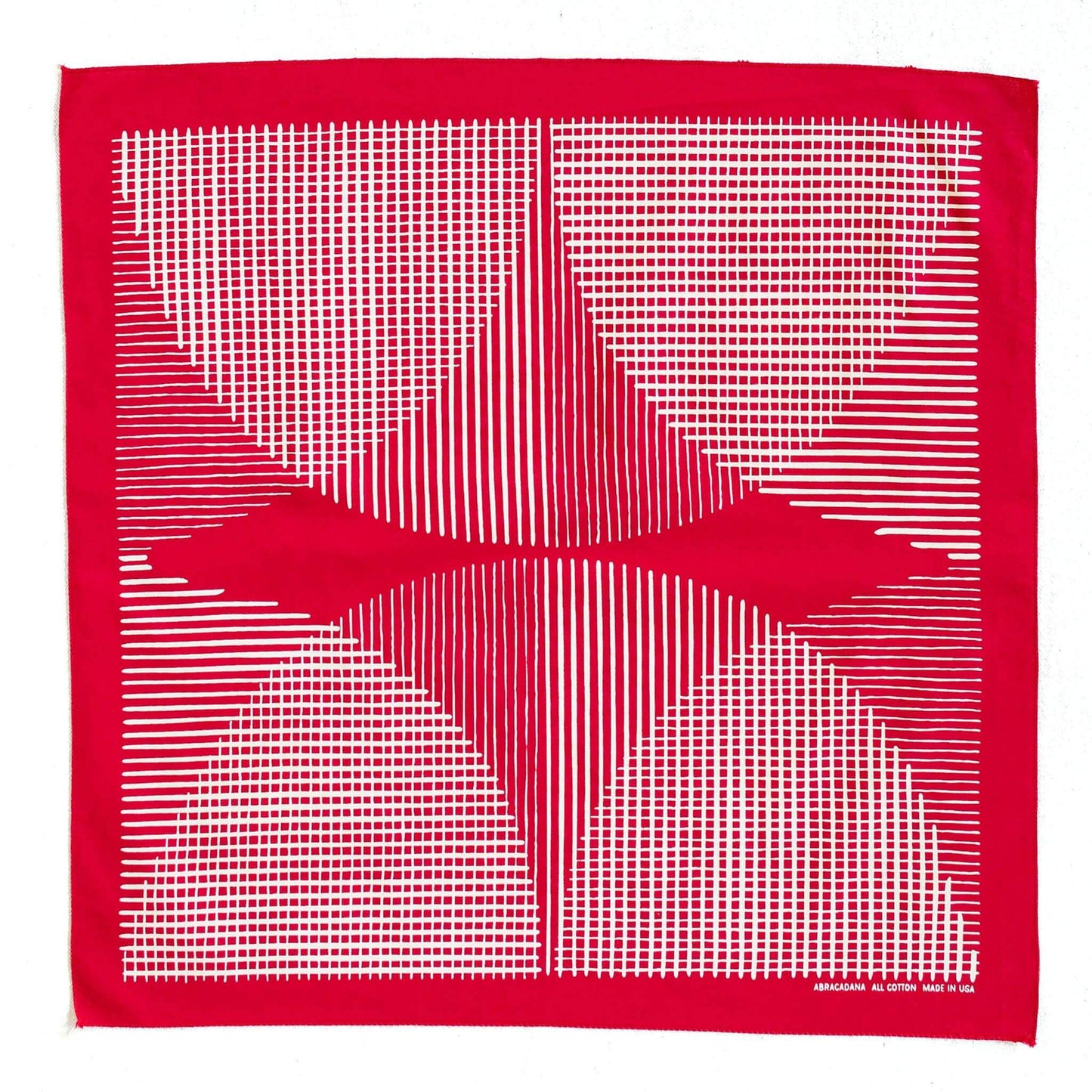 Red fabric with white geometric pattern on a white background