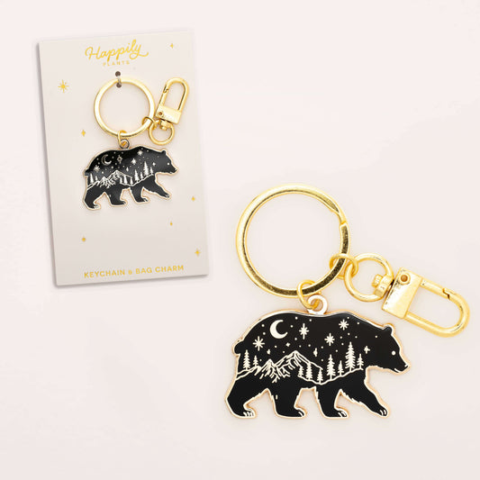 Black bear keychain charm with gold accents on a white background