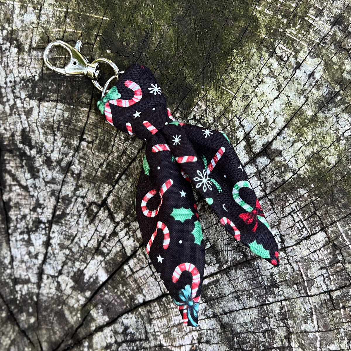 black mini scarf keychain with candy cane and holly print