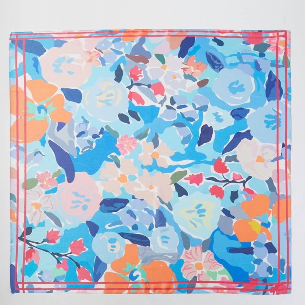 colorful abstract floral scarf on brown handbag