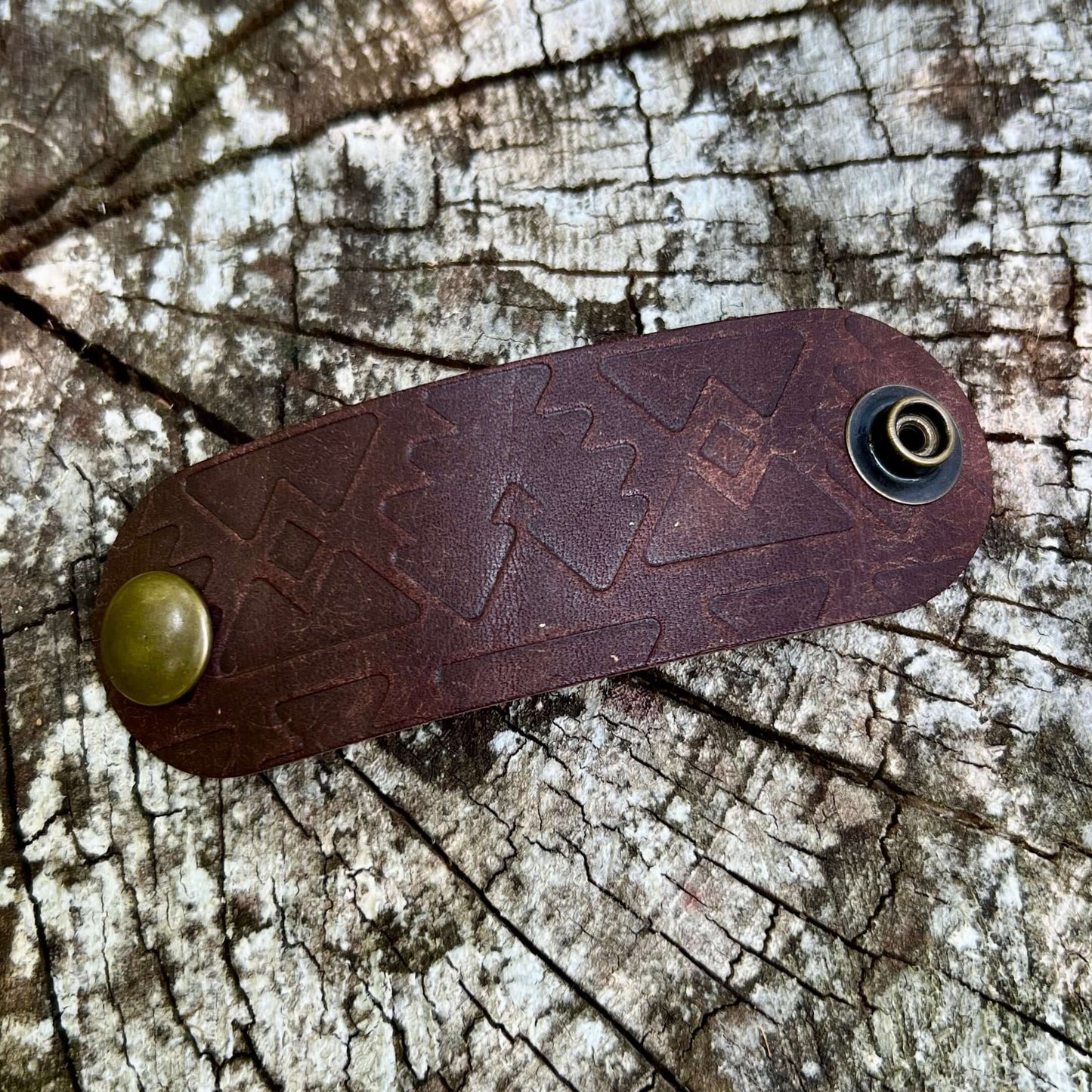 dark brown leather bandana slide embossed with southwest pattern
