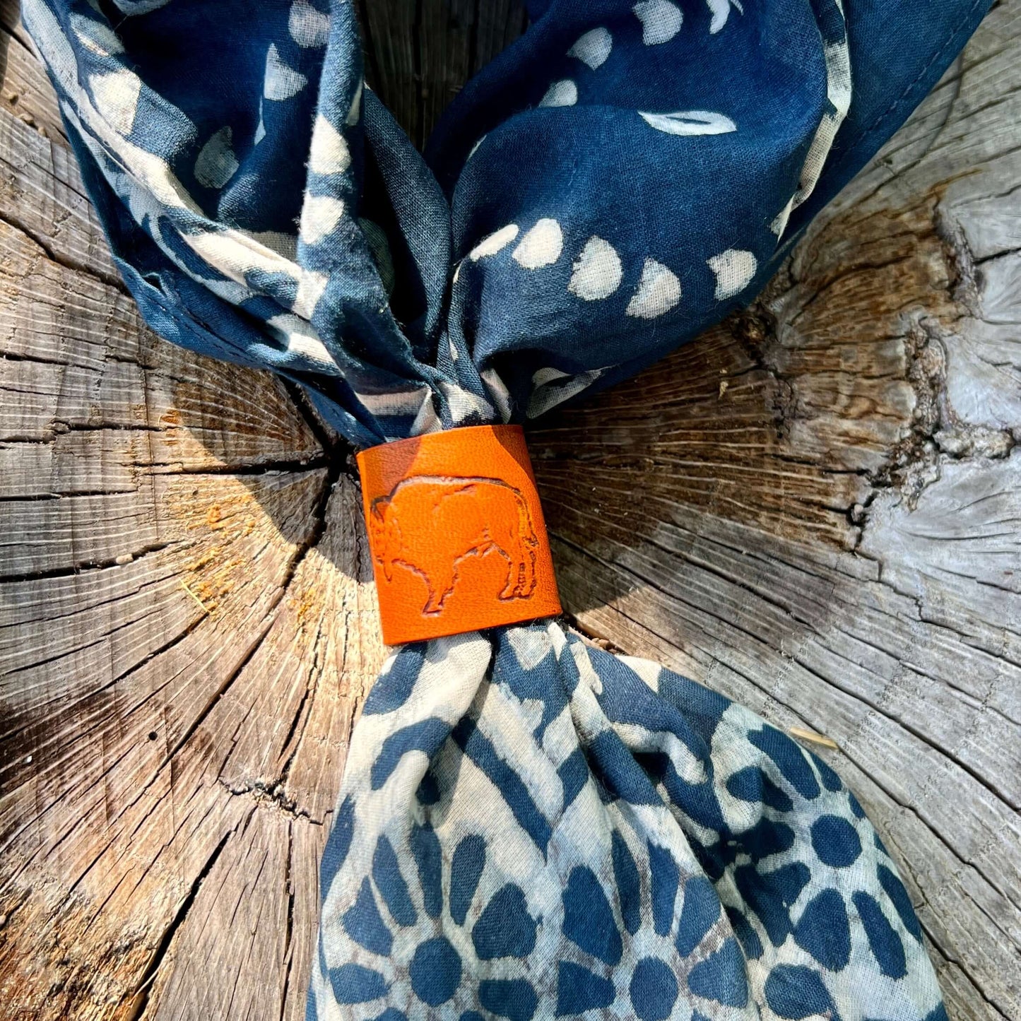 leather slide with buffalo on blue scarf