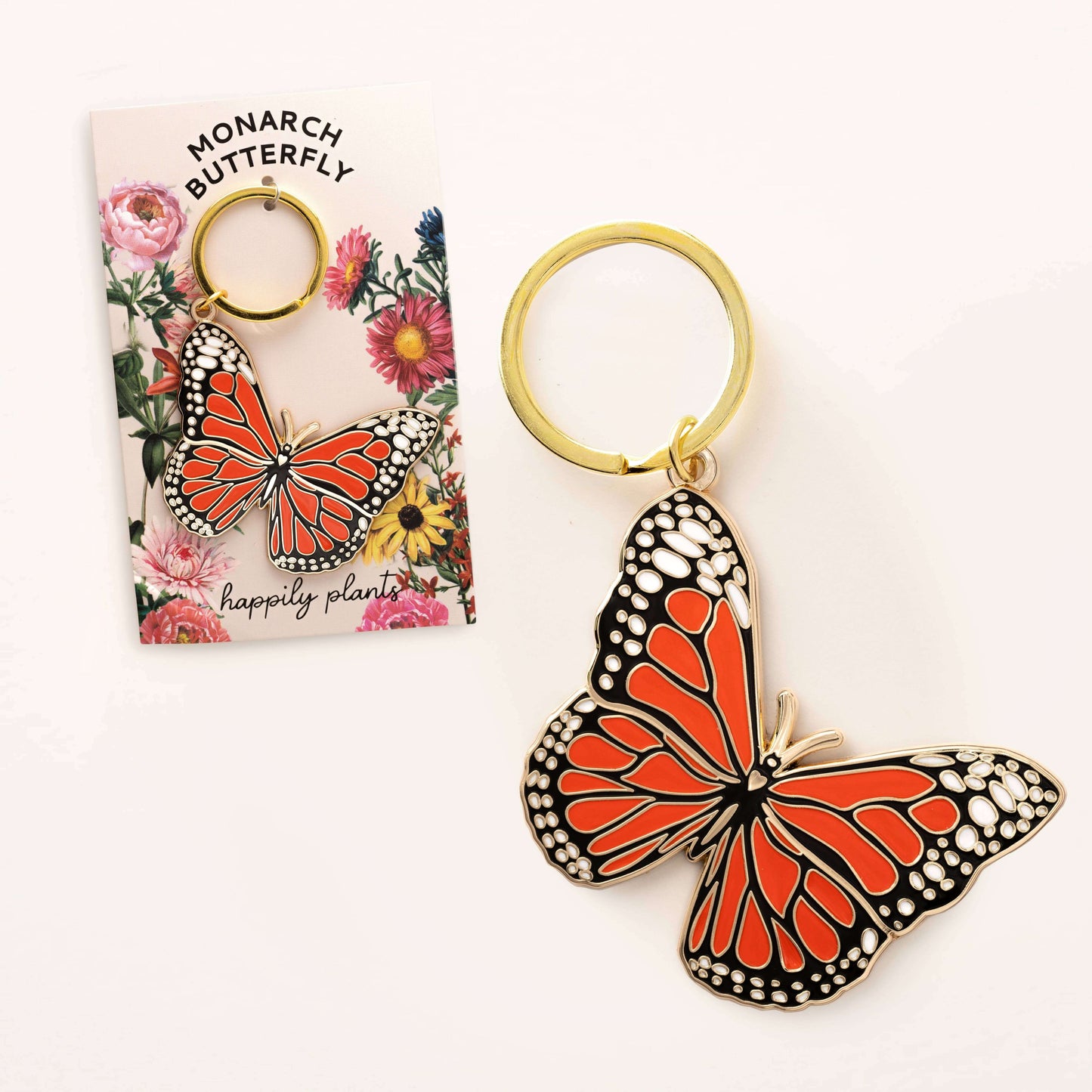 Butterfly keychain with packaging on a white background