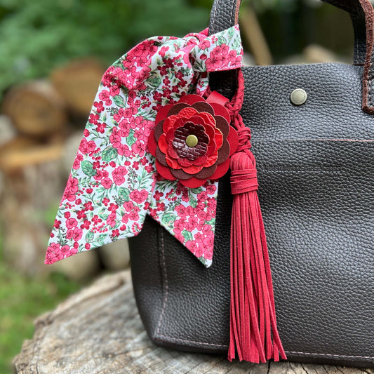 red leather flower bag charm with tassel and scarf