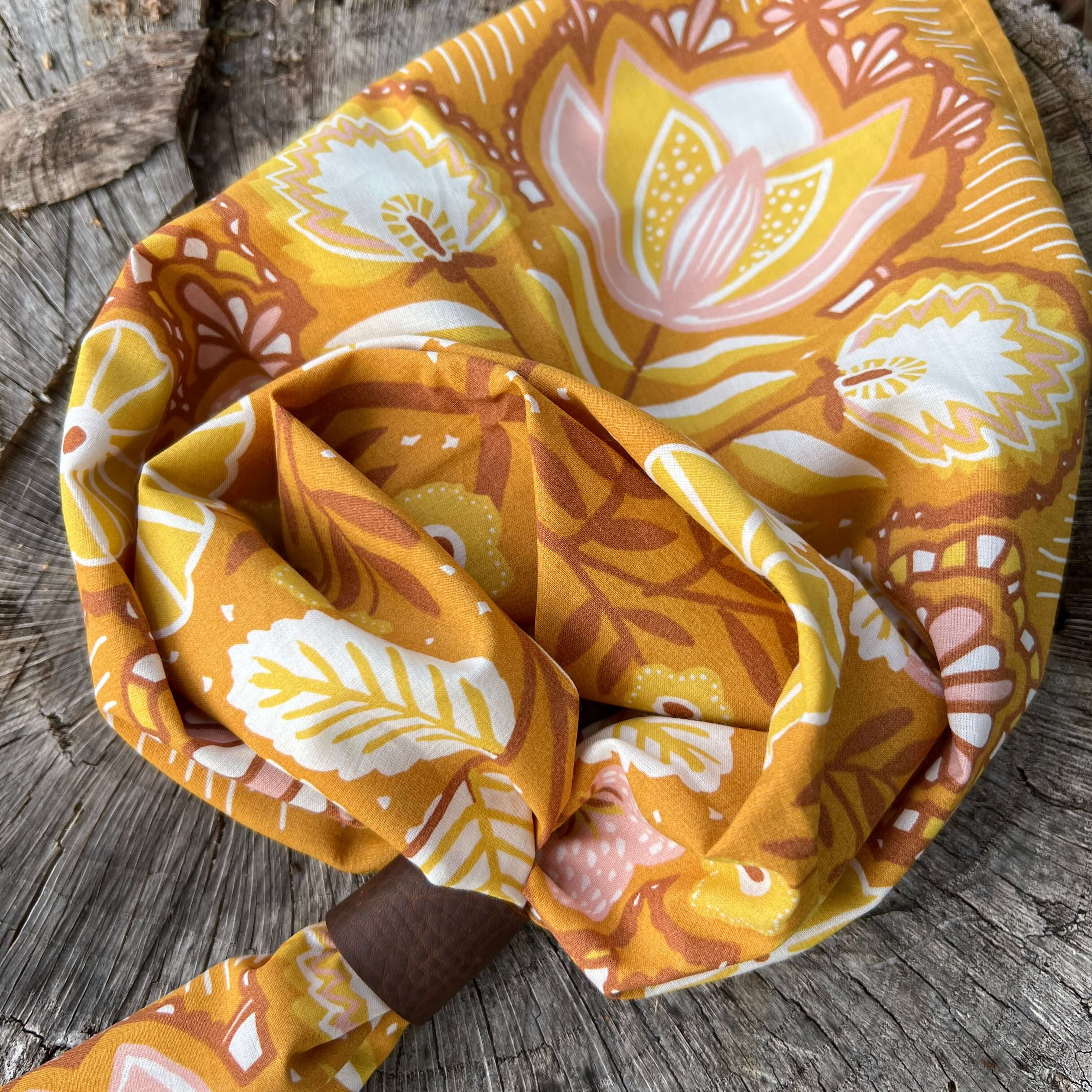 Floral patterned headscarf on a wooden surface