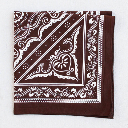 Brown bandana with white paisley pattern on a white background