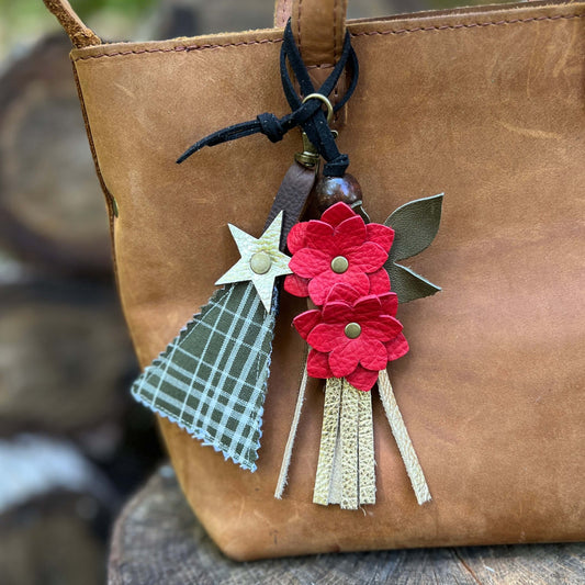 green plaid tree charm with red flower tassel charm on brown tote