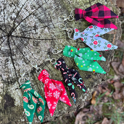 Christmas print mini scarf keychains on wooden surface