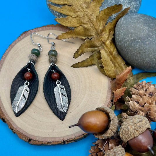 black leather petal with wooden bead and silver feather earrings.