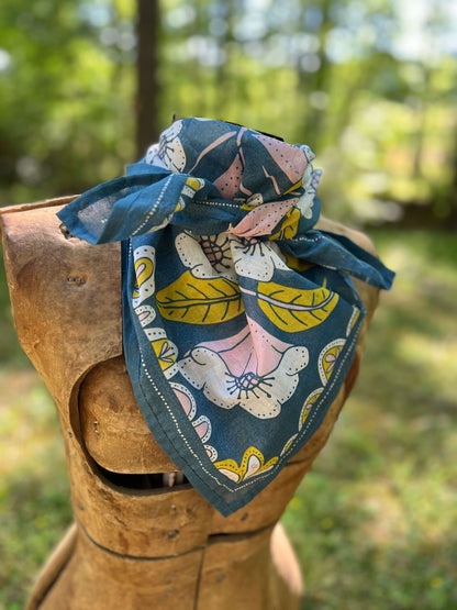 Fabric with floral pattern on a wooden block outdoors