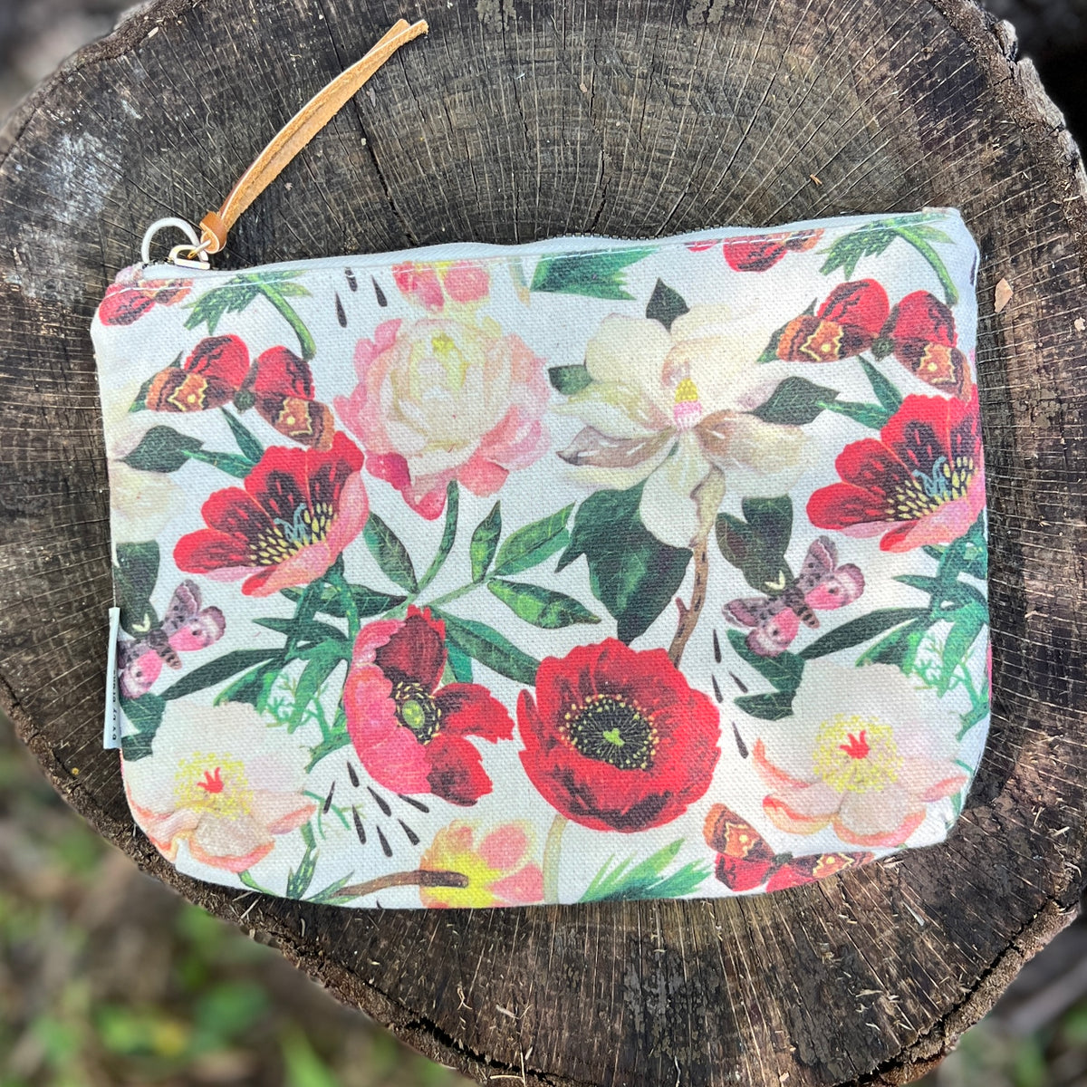 Floral patterned pouch with a zipper 