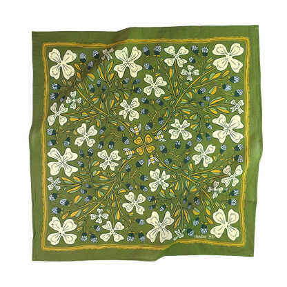 Green floral patterned fabric on a white background
