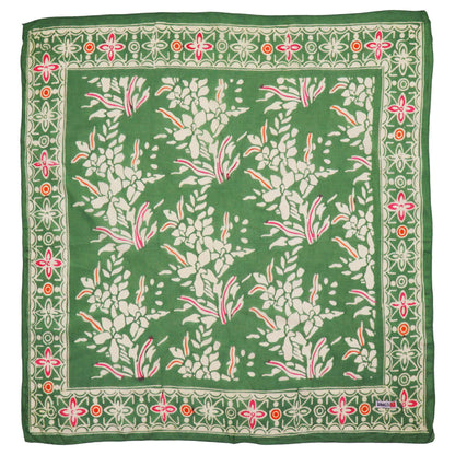 Green floral patterned batik bandana with a border on a white background