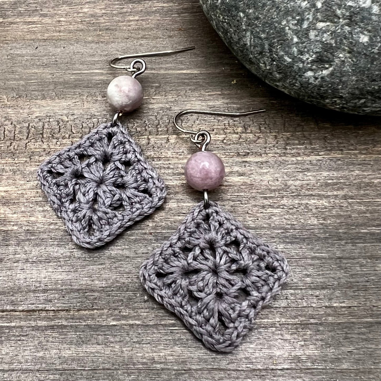 gray crocheted earrings with lilac stone