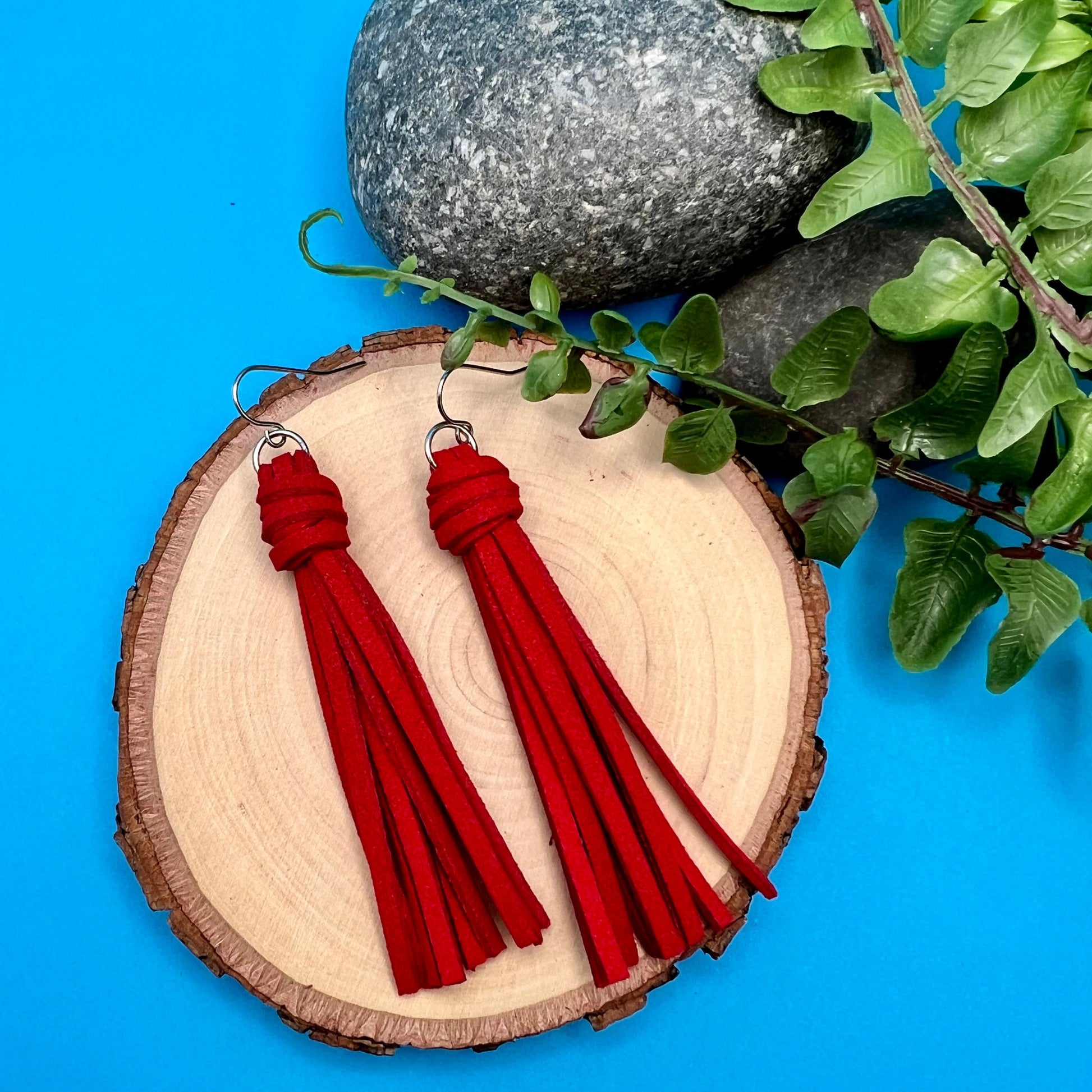 red faux suede tassel earrings