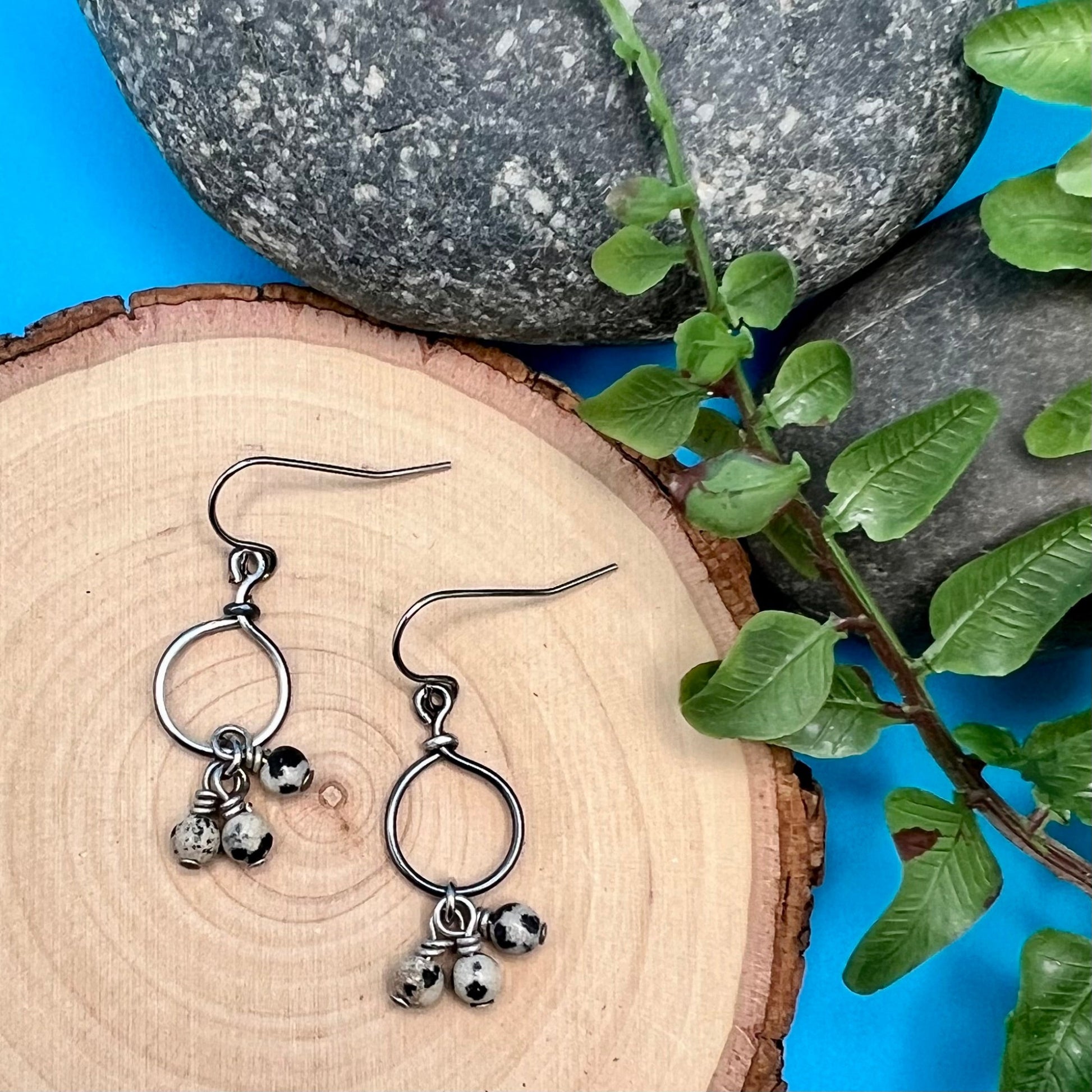 tiny steel hoop earrings with dalmatian jasper dangles