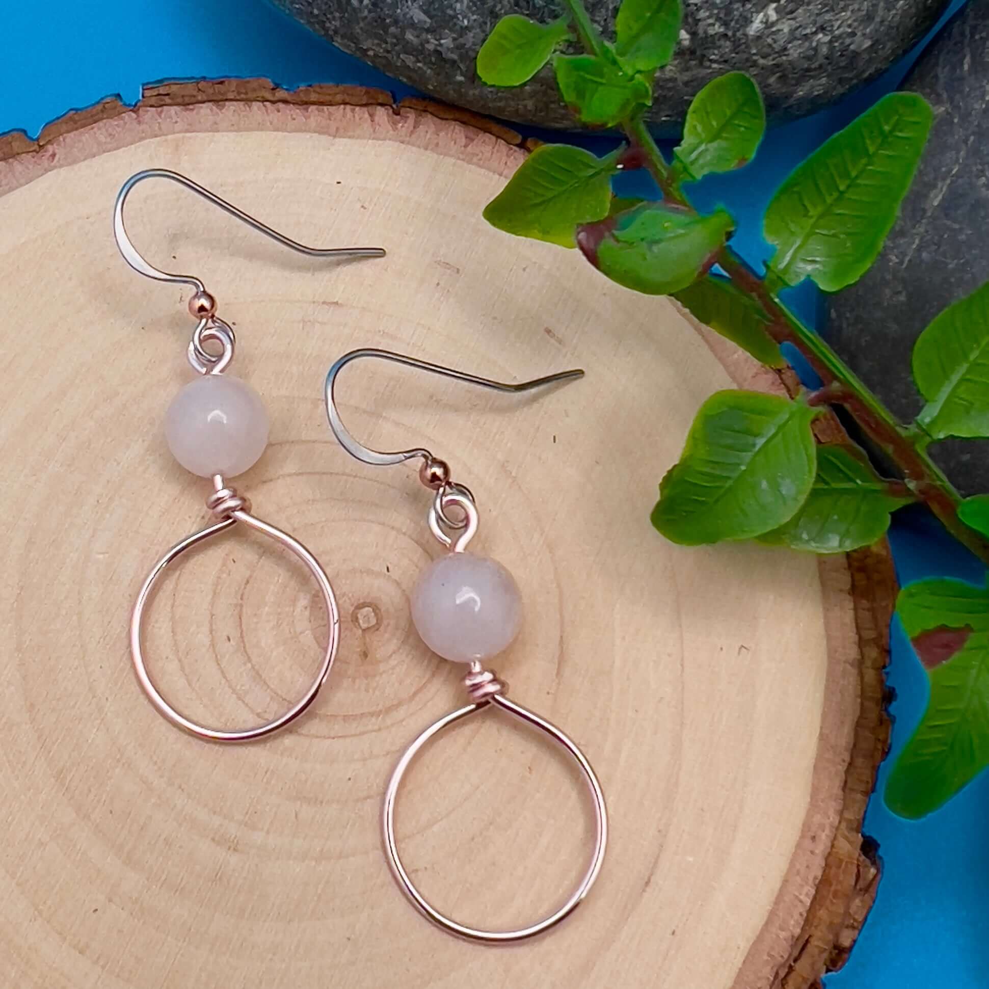 Dangle Hoop Earrings - Rose Gold with Pink AventurineSmall hoops are accented with natural stones for chic everyday style. Hoops are hand formed with nickel free and tarnish resistant enameled copper wire. .75" diameter hoop 1.25" dangle on naturally hypo