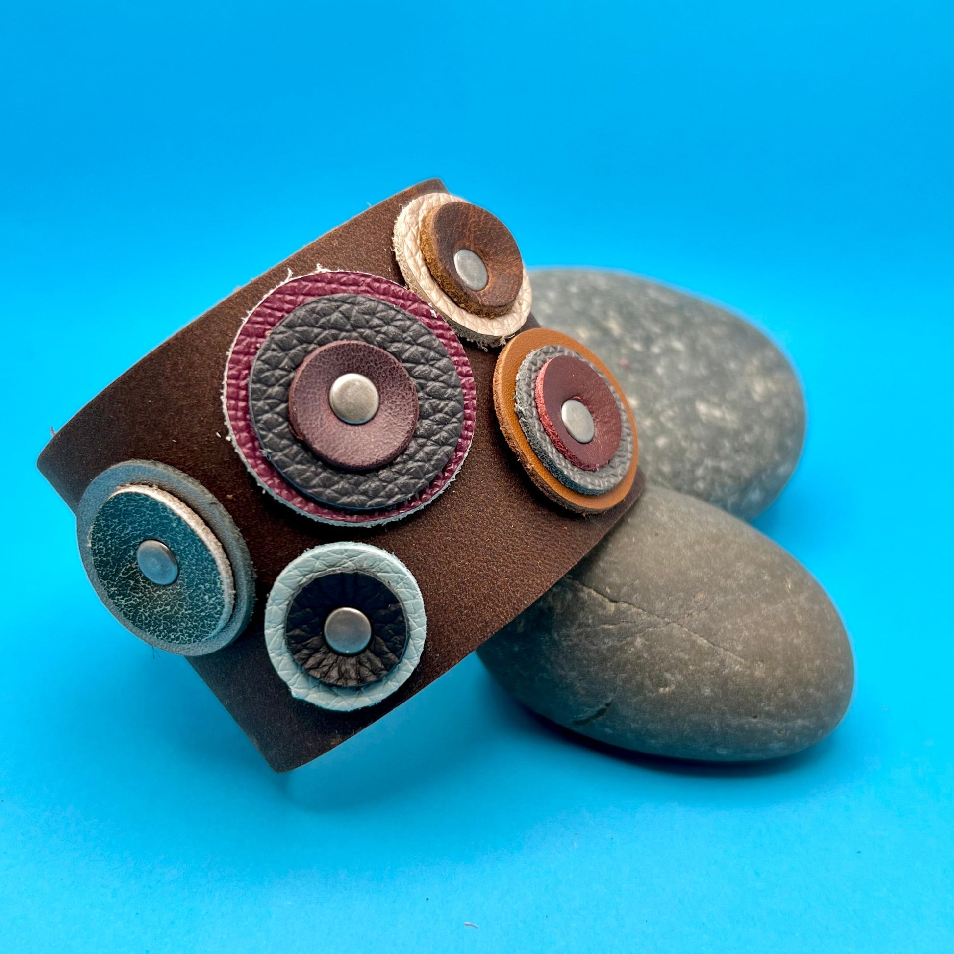 wide brown leather cuff bracelet with geometric circles