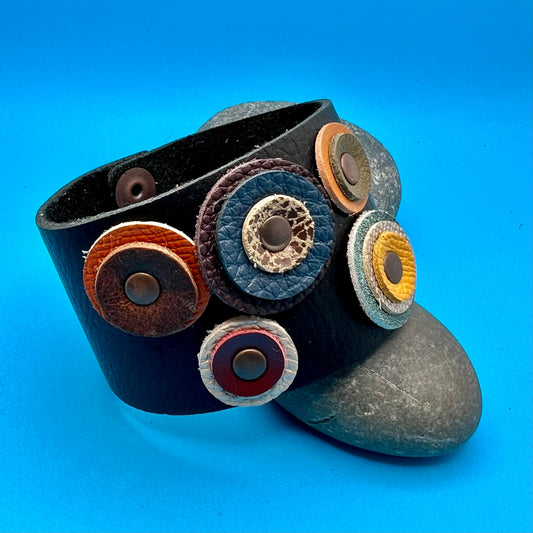 8" long black leather cuff bracelet with leather circles.