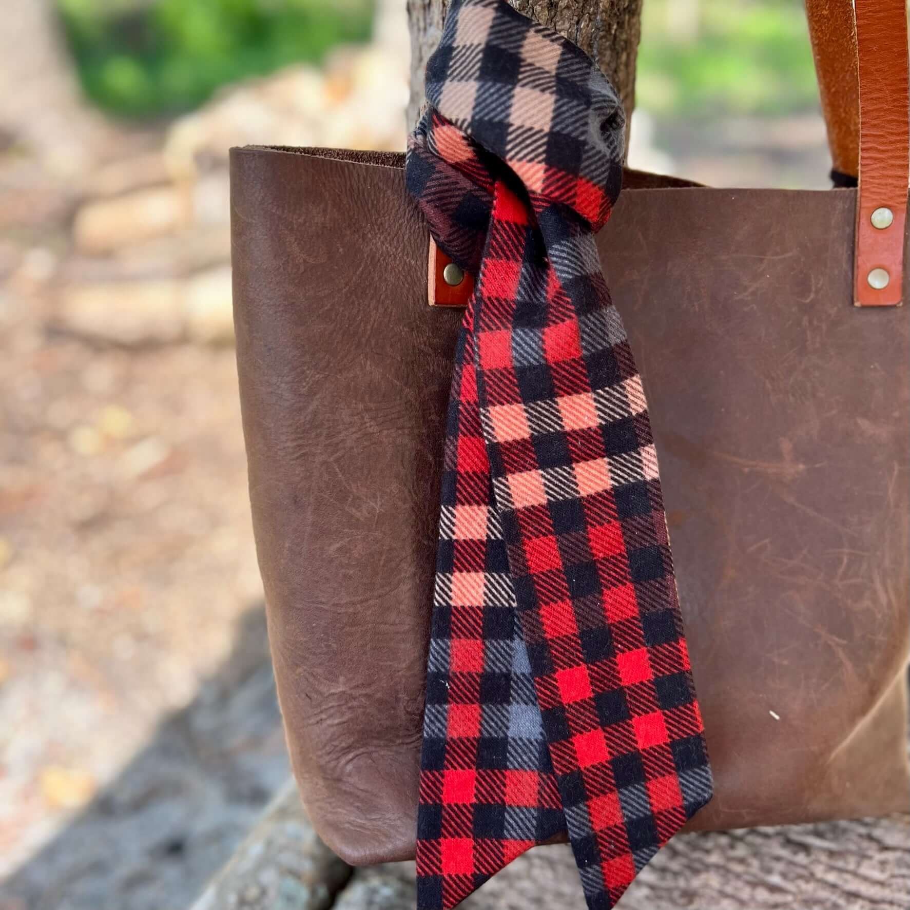 Purse Scarf - Fall Plaid FlannelA little cozy for your purse, handbag or tote. Flannel purse scarf will give your bag or tote an instant Fall update. Tie it in a bow or a simple knot. Looks great with tassels or other bag charms. 100% cotton flannel 2.5"