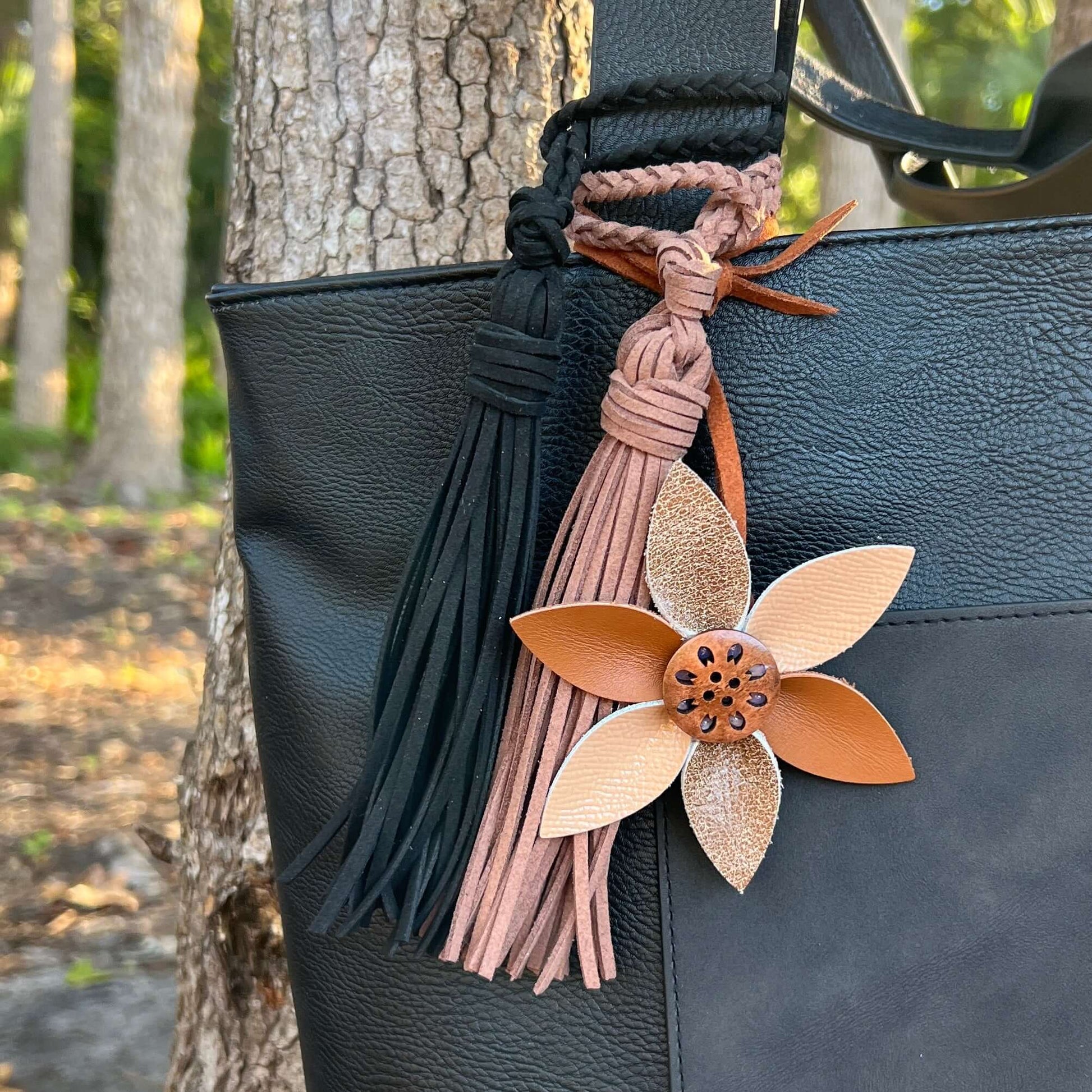 Leather Flower Bag Charm with Tote Loop in Beige and BrownBag charms are a great way to update your handbag, purse or tote. Each flower is crafted with leather petals securely sewn and glued together. Colorful wooden button adds a little boho flair. Flowe