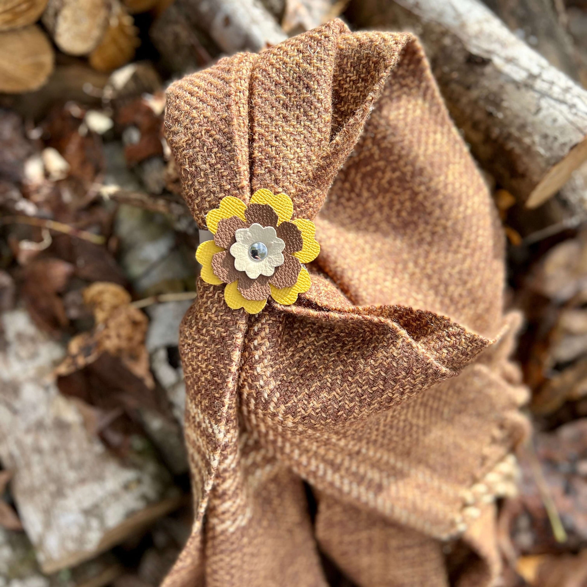 Scarf Cuff - Leather Flowers For Shawls and ScarvesHandcrafted from premium leather, this scarf cuff is a beautiful way to elevate any outfit. Featuring a colorful layered flower, it easily attaches to shawls, scarves, or handbags. Flowers are between 2.2