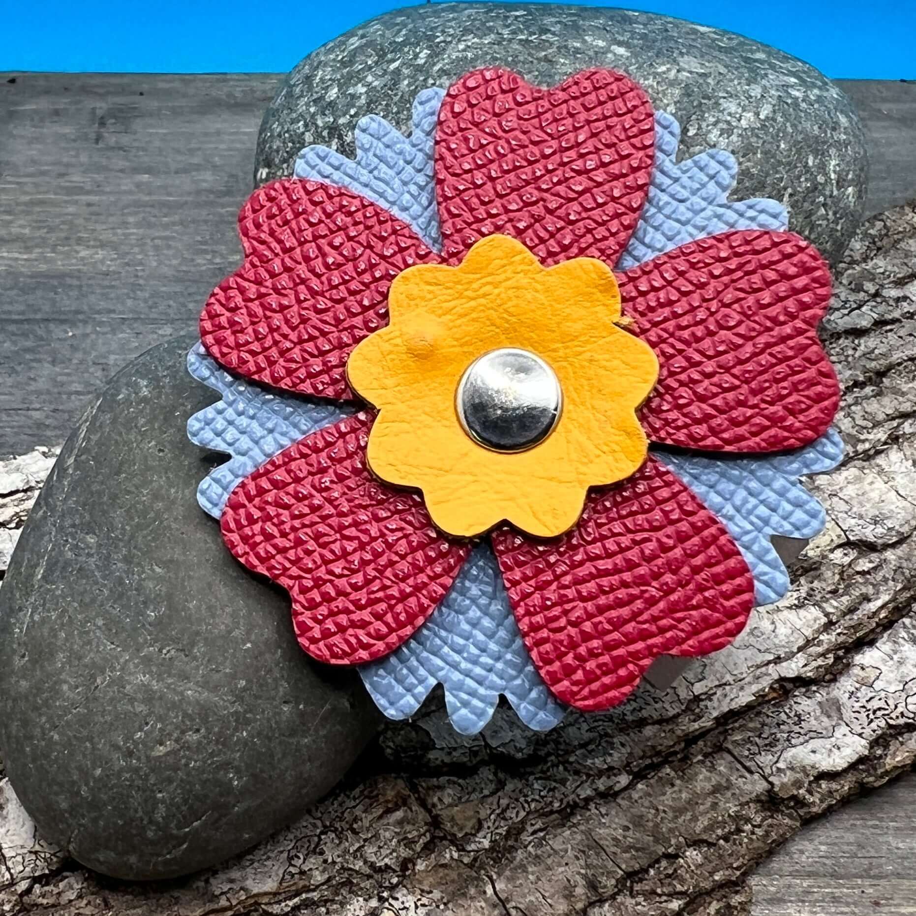 Scarf Cuff - Leather Flowers For Shawls and ScarvesHandcrafted from premium leather, this scarf cuff is a beautiful way to elevate any outfit. Featuring a colorful layered flower, it easily attaches to shawls, scarves, or handbags. Flowers are between 2.2