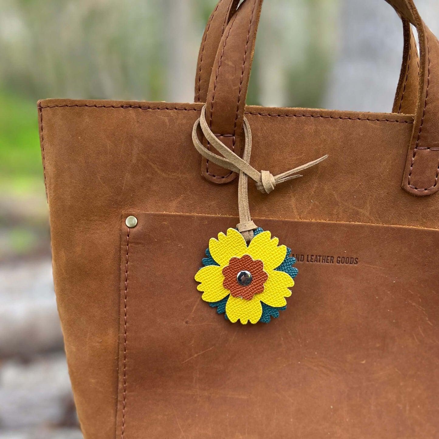 Small Leather Flower Purse Charm - Teal, Yellow and OrangeWhen you want just a little pop of color for your handbag or purse. Update an old bag or tote with a genuine leather layered flower. Add a single flower to your small cross body or layer with other