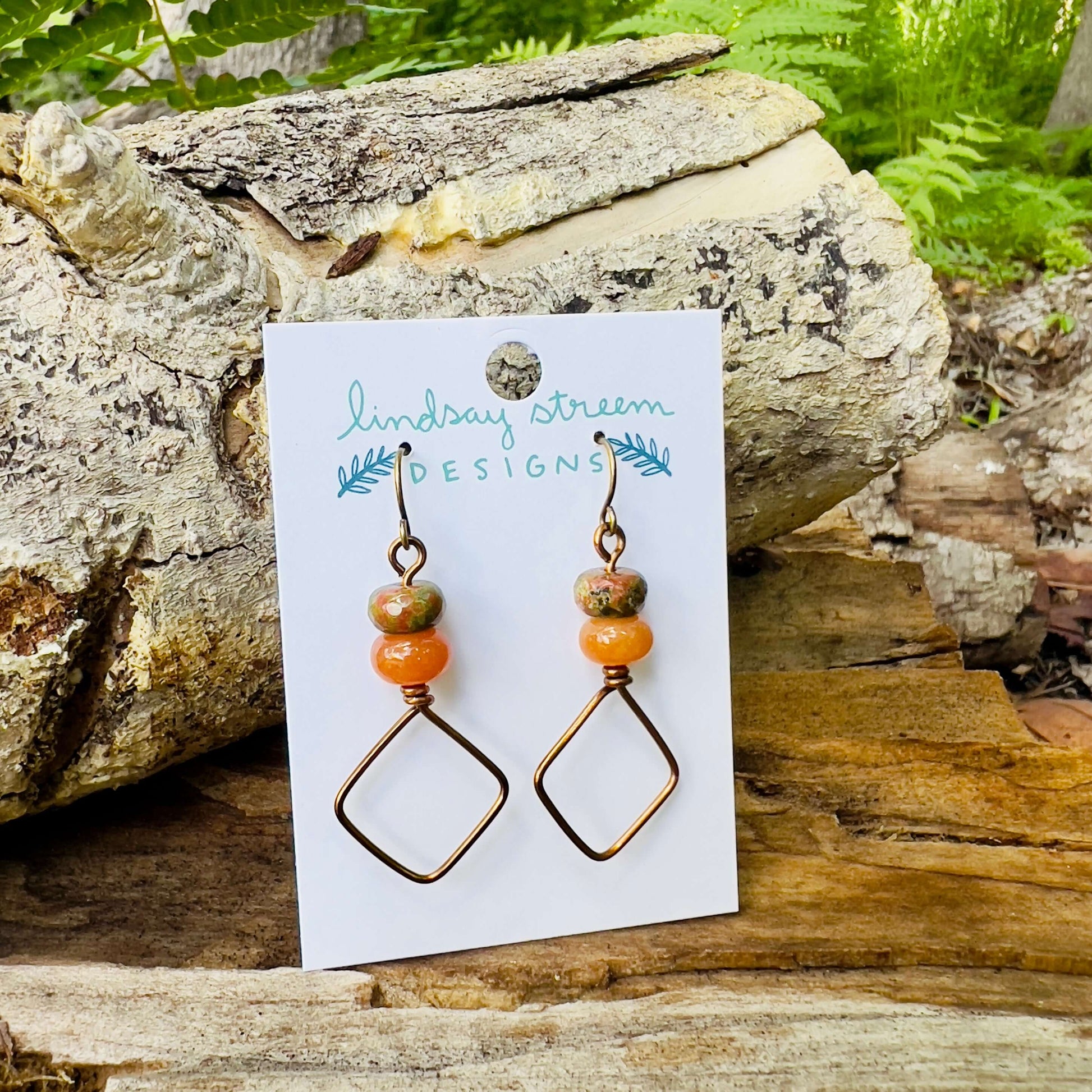 Square Hoop Earrings - Bronze with Unakite and AventurineSimple and chic vintage bronze dangle hoop earrings are perfect for everyday style. Crafted with tarnish resistant enameled copper wire and accented with colorful natural stones. .75" diameter hoop