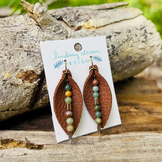 Leather Petal Earrings - Warm Brown with Fancy JasperAdd a little boho flair to your day with genuine leather earrings. Warm brown leather petal is accented with genuine fancy Jasper and bronze glass bead on antique gold arrowhead pin. Lightweight earring