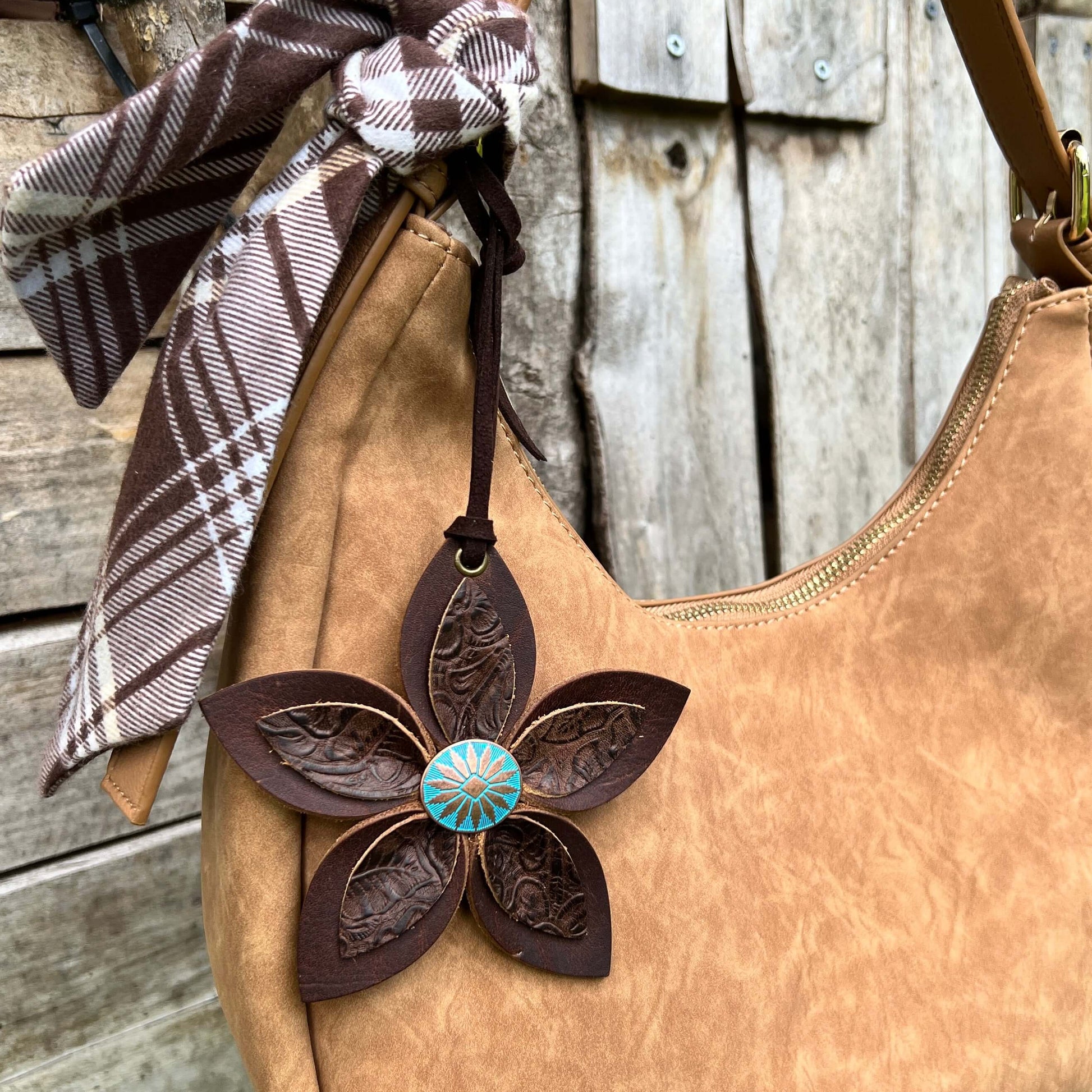 Leather Flower Bag Charm - Large Flower with Loop - Western BrownLeather purse charms are a great way to update your handbag, purse or tote. Each flower is crafted with leather petals securely sewn and glued together and accented with buttons in the cente