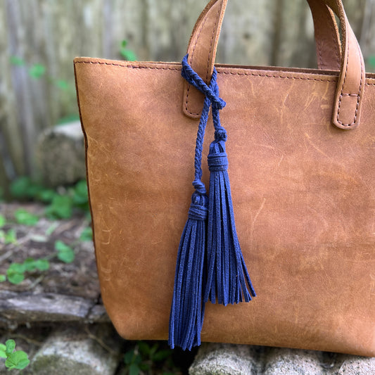 navy blue faux suede tassel on tan tote 