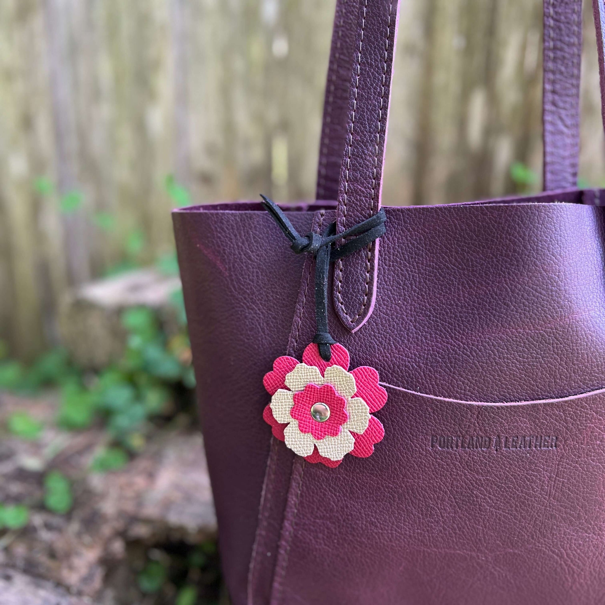 Small Leather Flower Purse Charm - Berry Pink and Rose GoldWhen you want just a little pop of color for your handbag or purse. Update an old bag or tote with a genuine leather layered flower. Add a single flower to your small cross body or layer with othe