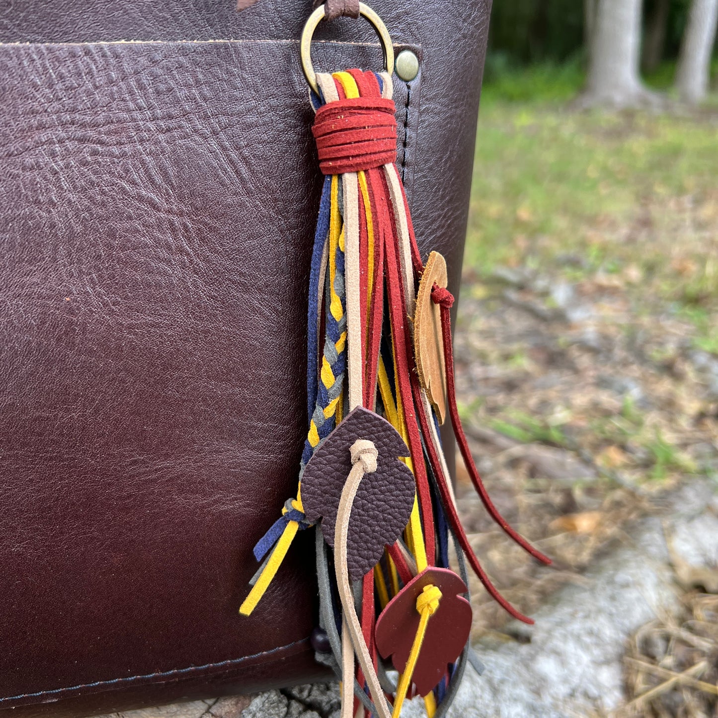 faux suede fringe tassel bag charm with leather feathers, braids and wood beads