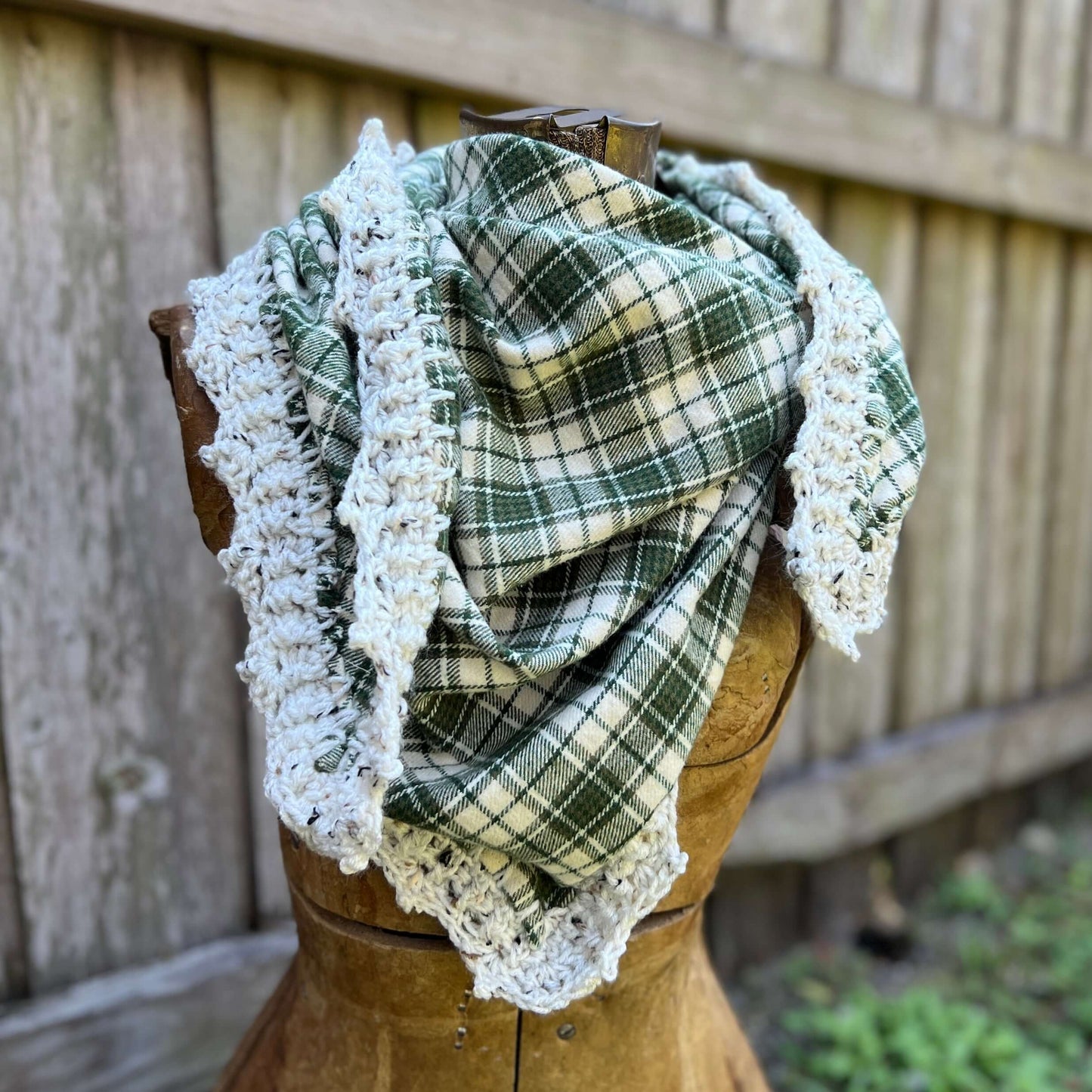 Flannel Triangle Scarf with Crochet TrimBohemian fall style and a one of a kind scarf. Cotton flannel triangle is edged with a crochet trim. Flannel has been hemmed to prevent fraying and edge is crocheted directly onto the scarf. Super versatile designs