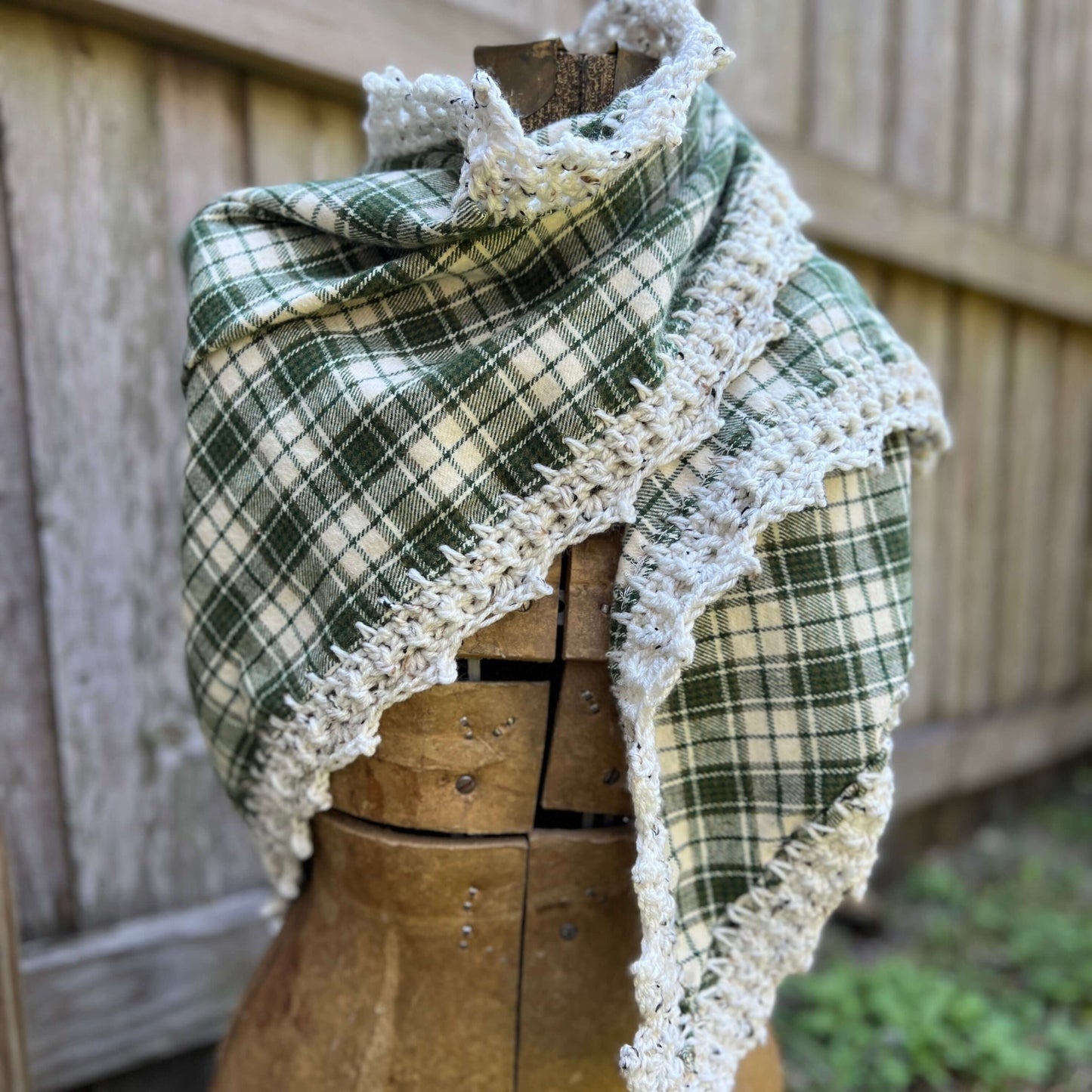 Flannel Triangle Scarf with Crochet TrimBohemian fall style and a one of a kind scarf. Cotton flannel triangle is edged with a crochet trim. Flannel has been hemmed to prevent fraying and edge is crocheted directly onto the scarf. Super versatile designs