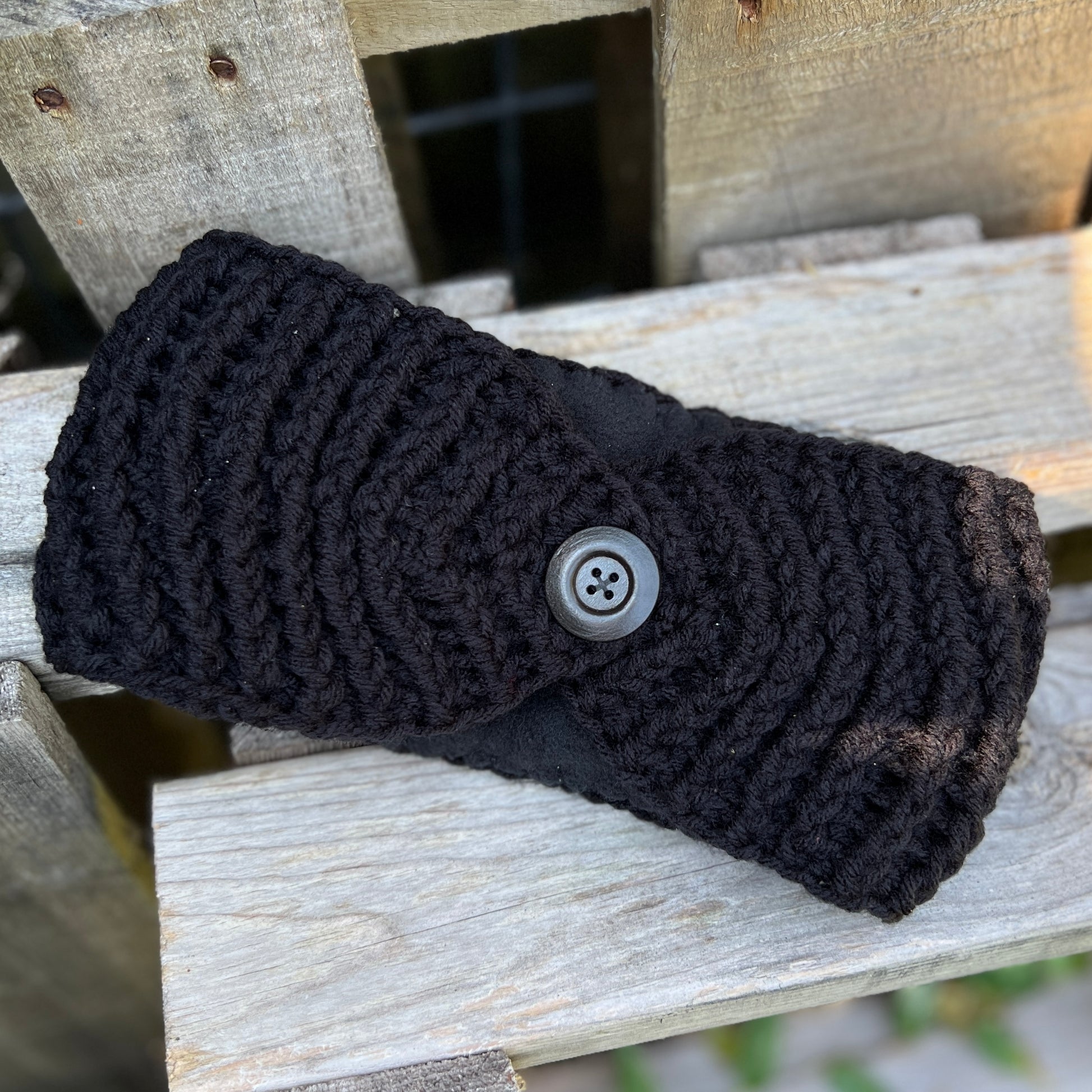 Winter Headband with Fleece Lining - Solid ColorsKeep your ears nice and warm without messing up your do. Crocheted with super soft acrylic yarn and lined with fleece for extra warmth. Button can be worn in the back, front or on the side. 4.75" wide - ext