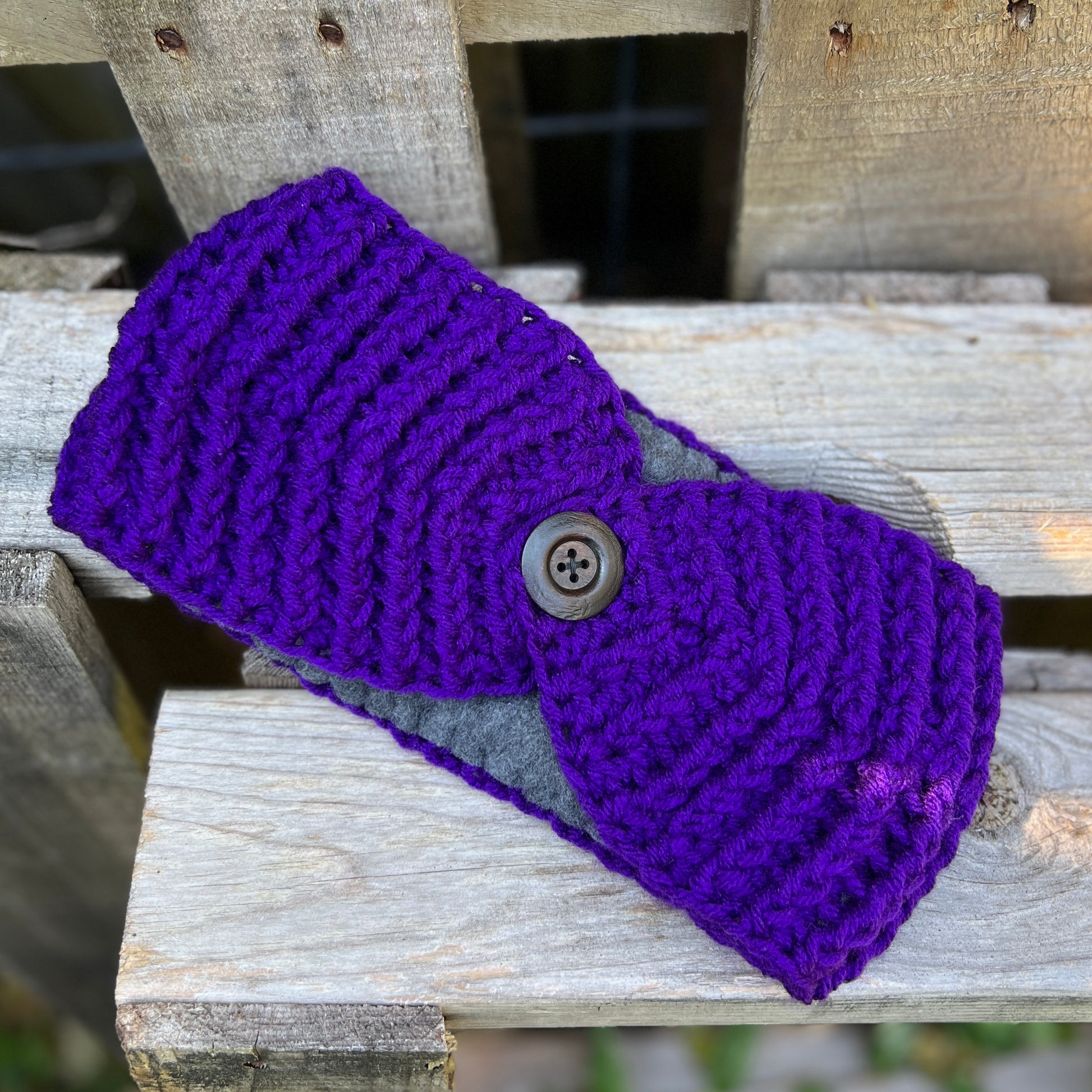 Winter Headband with Fleece Lining - Solid ColorsKeep your ears nice and warm without messing up your do. Crocheted with super soft acrylic yarn and lined with fleece for extra warmth. Button can be worn in the back, front or on the side. 4.75" wide - ext