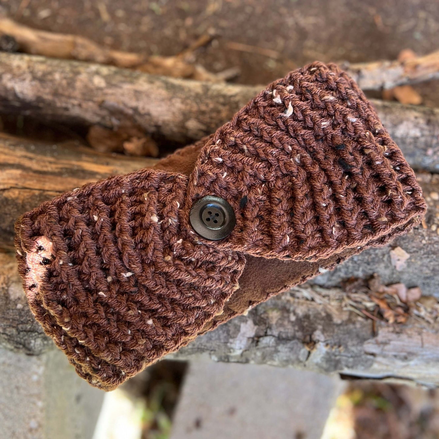 Winter Headband with Fleece Lining - Brown TweedKeep your ears nice and warm without messing up your do. Crocheted with super soft acrylic yarn and lined with fleece for extra warmth. Button can be worn in the back, front or on the side. 4.75" wide - extr