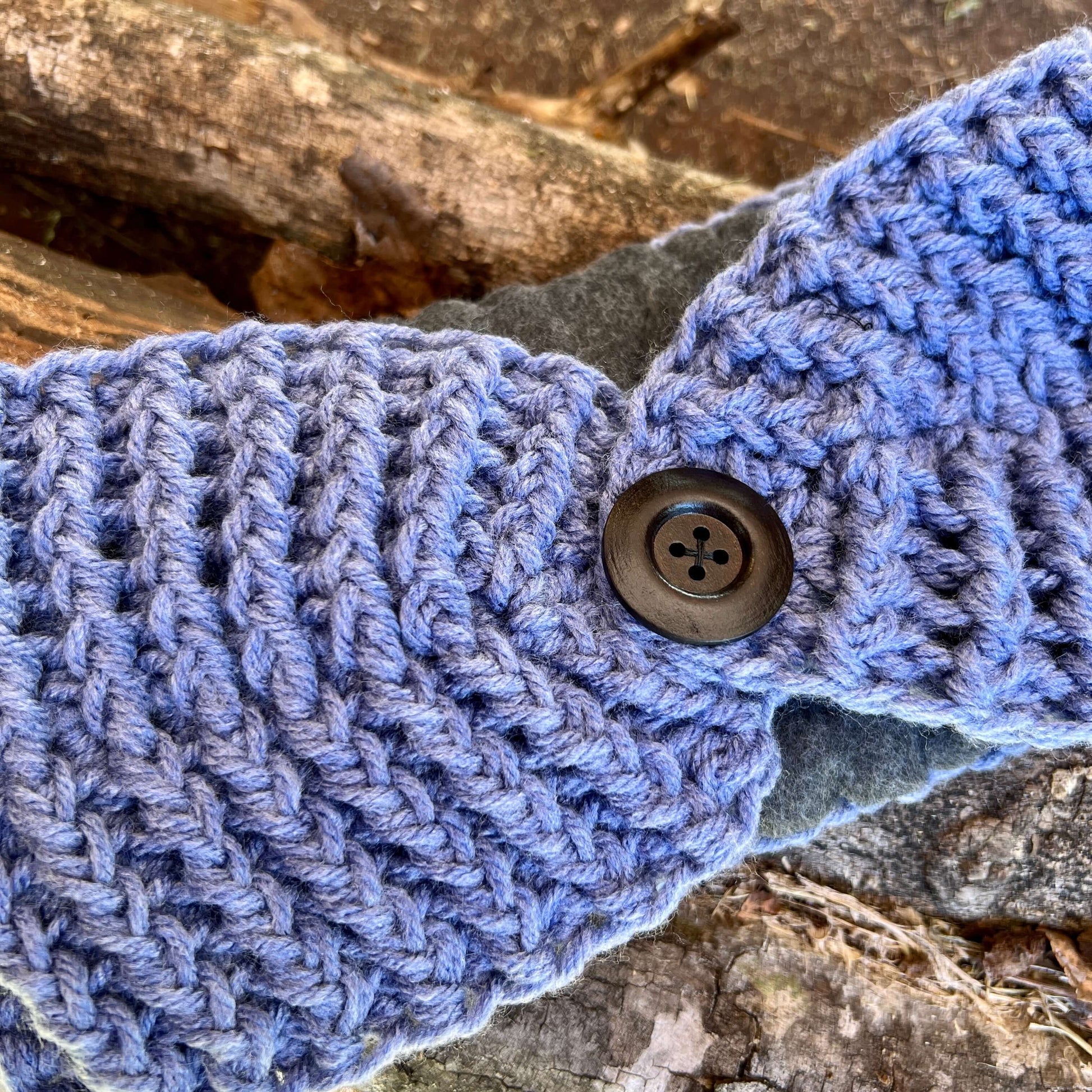 Winter Headband with Fleece Lining and Working Button - Denim BlueKeep your ears nice and warm without messing up your do. Crocheted with super soft acrylic yarn and lined with fleece for extra warmth. Button can be worn in the back, front or on the side.