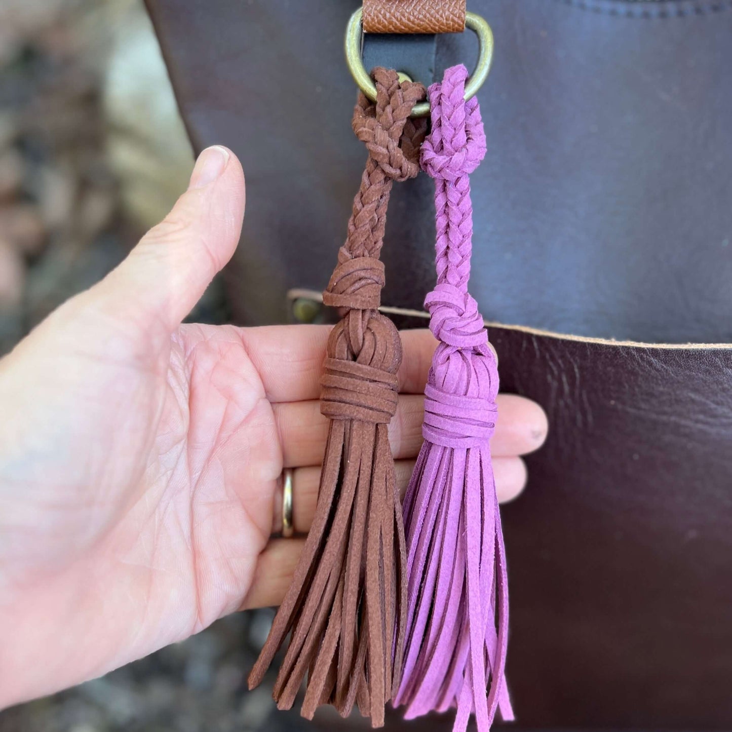 Bag Charm - Mini 4" Tassel for Purses & Totes Faux Suede LeatherJazz up your tote bag, handbag or key chain with a tassel. Lariat style tassels are crafted from faux suede leather so they are stylish and cruelty free. Loop it around your bag strap, purse