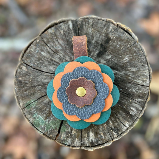 Leather Flower Bag Charm - Jade, Orange, Blue and BrownLeather flower charms are the perfect way to add a little flair to your handbag, tote or purse. Handcrafted with layers of genuine leather and securely riveted to a leather loop with your choice of ha