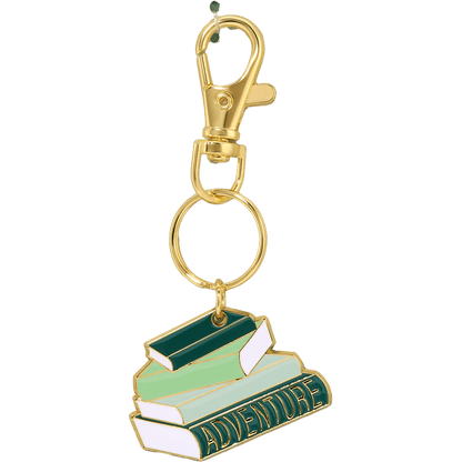 Keychain with book design and 'Adventure' text on a white background