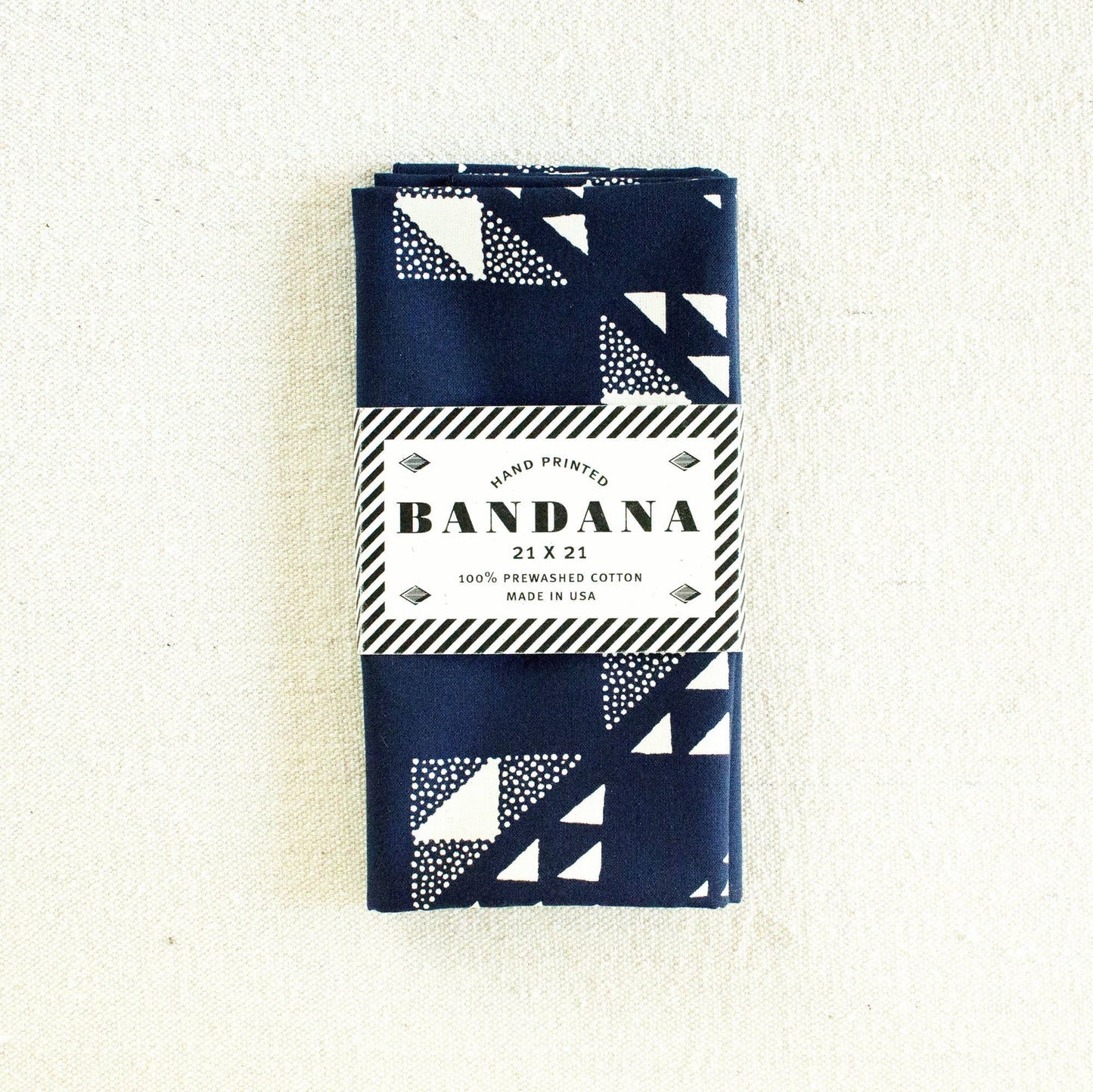 Packaged bandana with geometric pattern on a white background