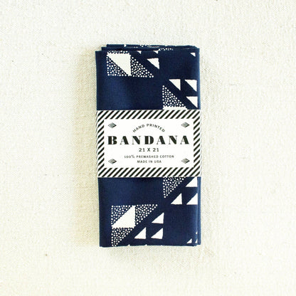 Packaged bandana with geometric pattern on a white background