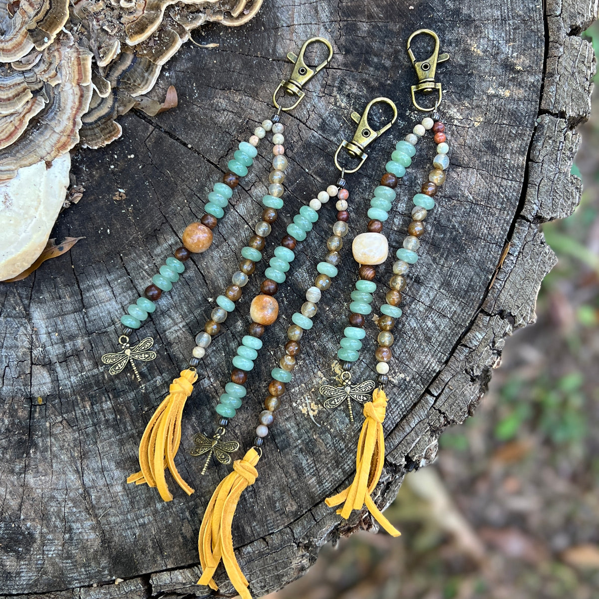 beaded bag charm in green aventurine, jasper and agate with tassel and dragonfly charm