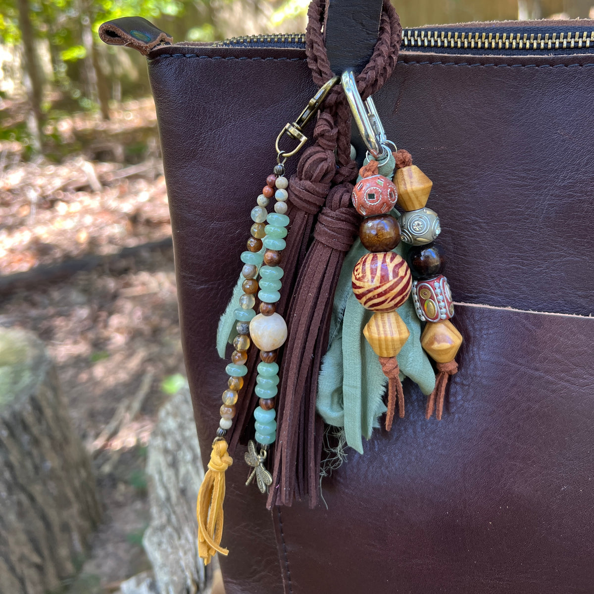 beaded bag charms and brown tassel on brown tote